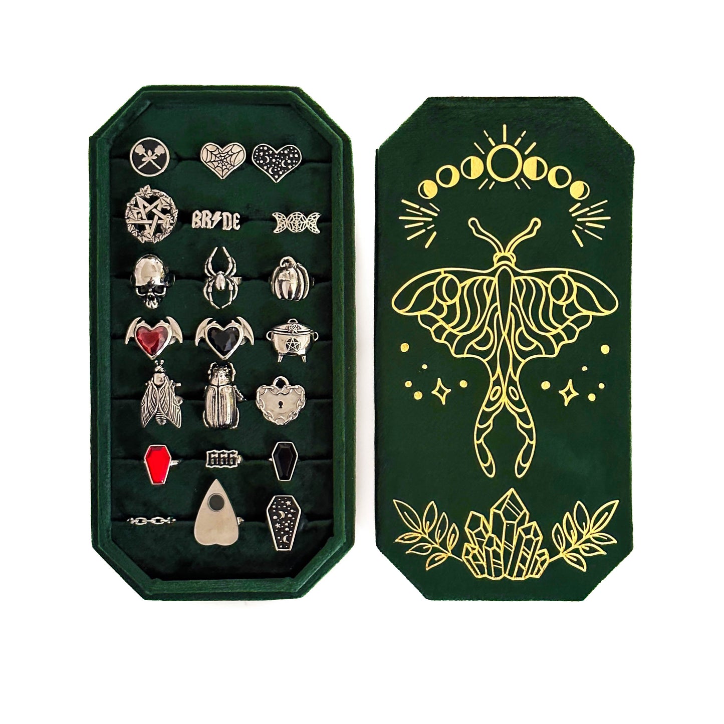 Set of rings in a green case with a decorative cover featuring a moth design.