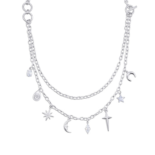 Layered stainless steel necklace with various charms on a white background