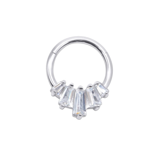 Stainless steel septum ring with clear gemstones on a white background