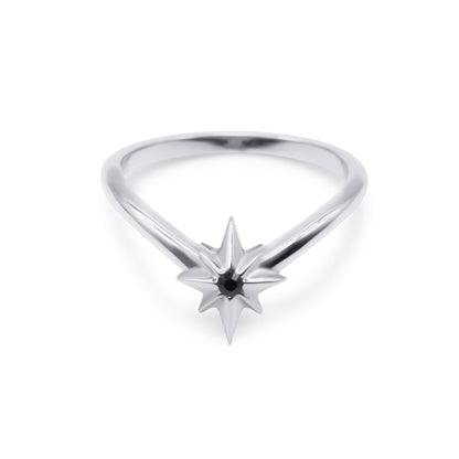 Silver ring with star-shaped design on a white background