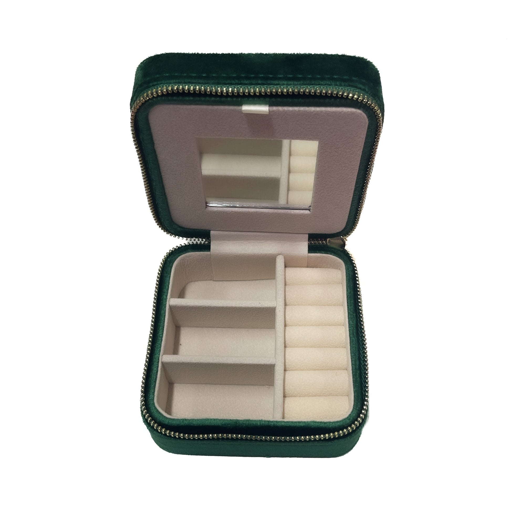 Green jewelry case with mirror and compartments on a white background