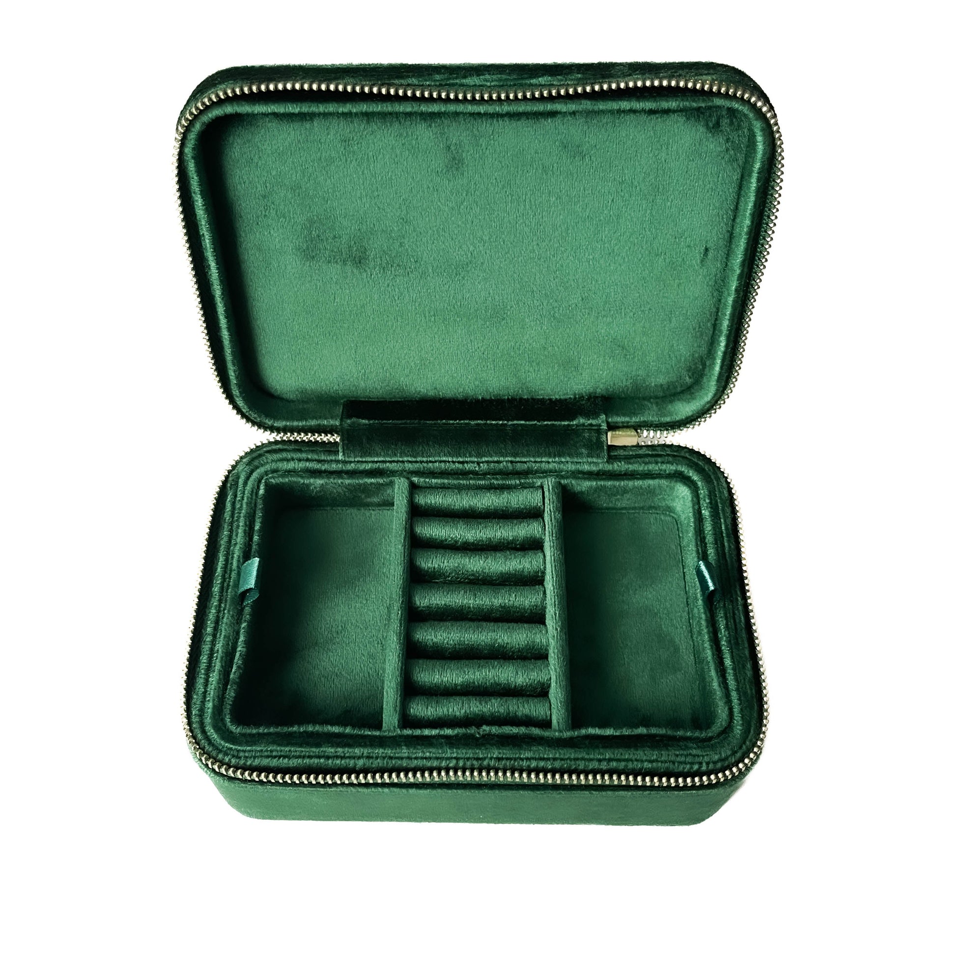 Green velvet jewelry case with compartments on a white background