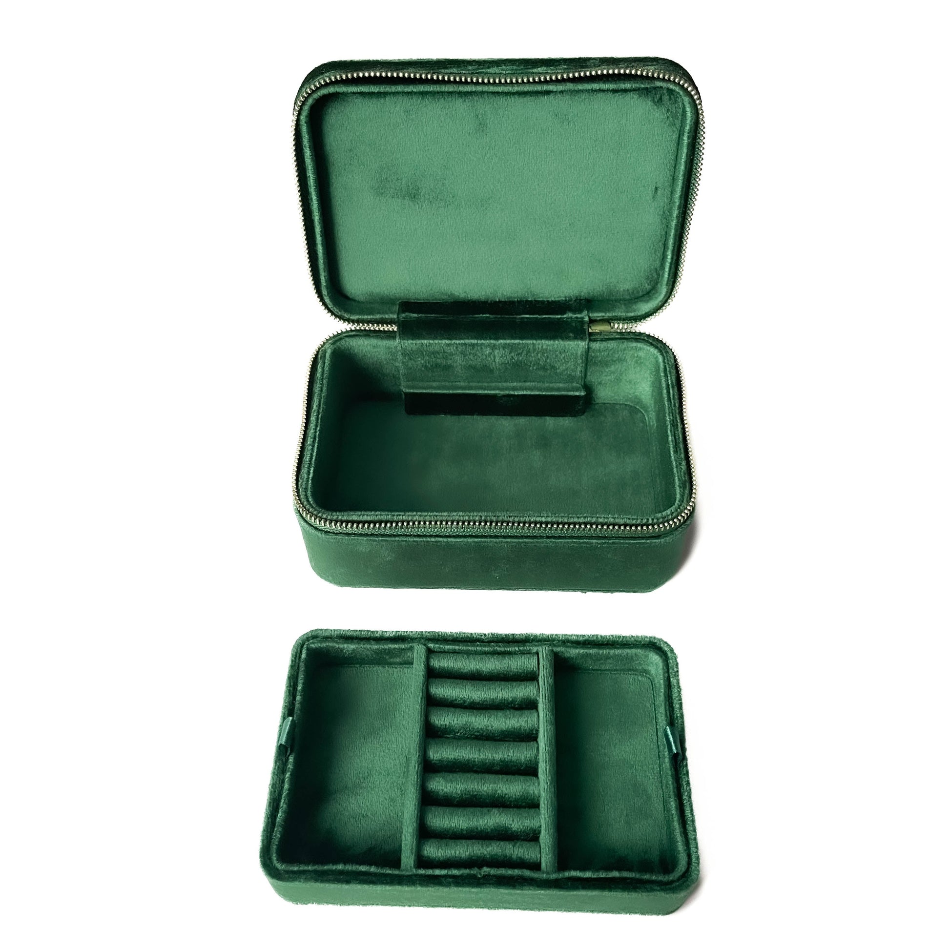 Green velvet jewelry case with compartments on a white background