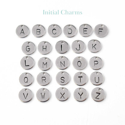 Hand stamped disc charms with initials.