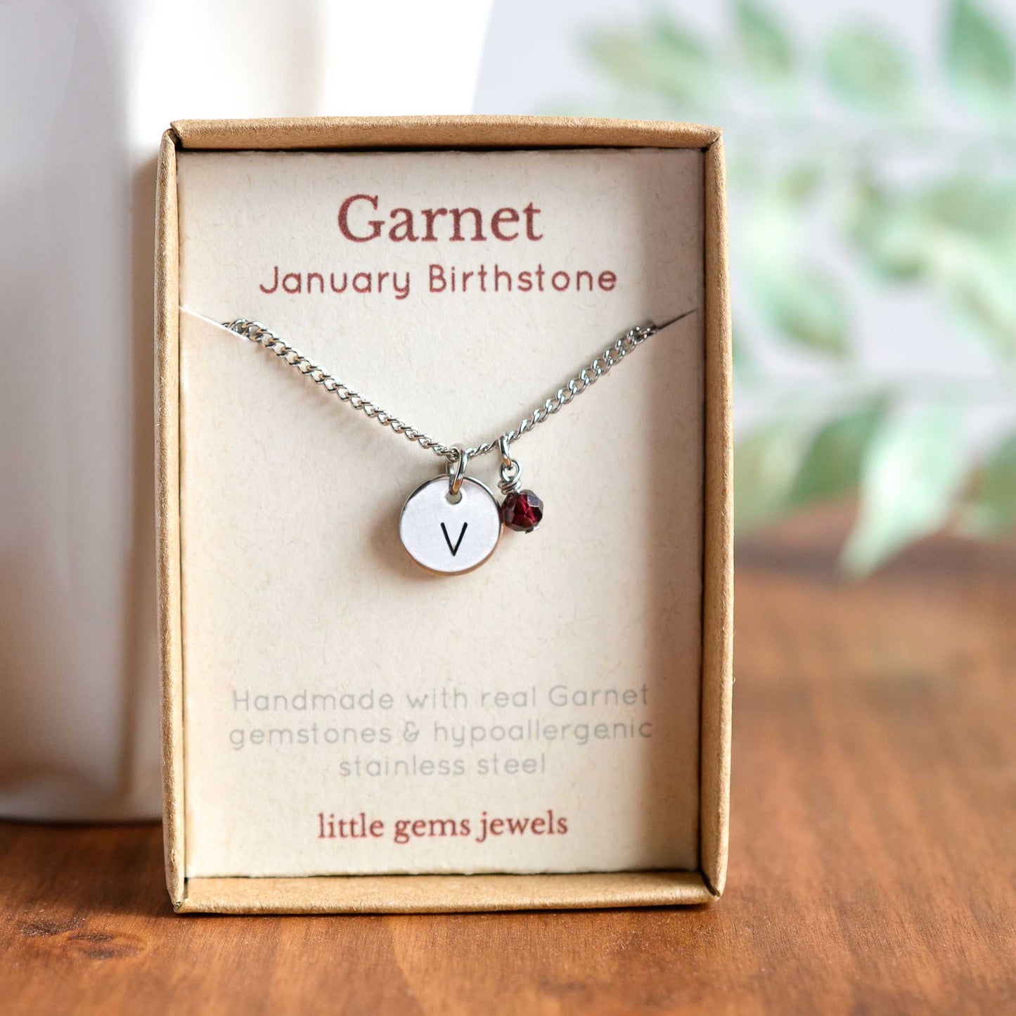 Garnet January birthstone and initial necklace in eco friendly gift box