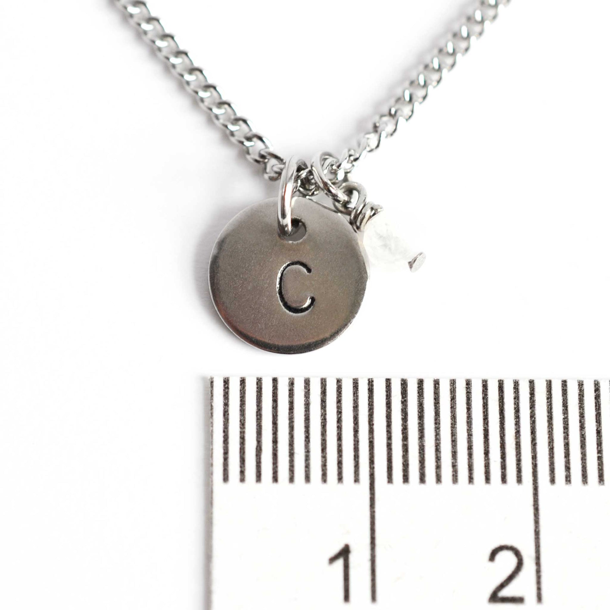 1cm diameter hand stamped initial pendant with 4mm June birthstone charm