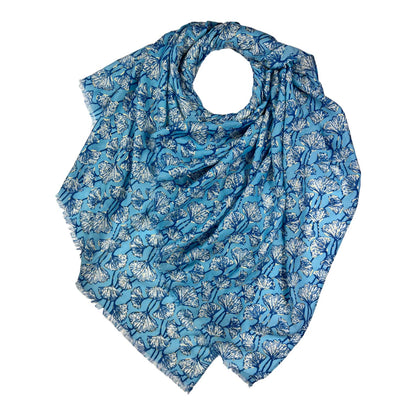 Blue floral patterned scarf on a white background