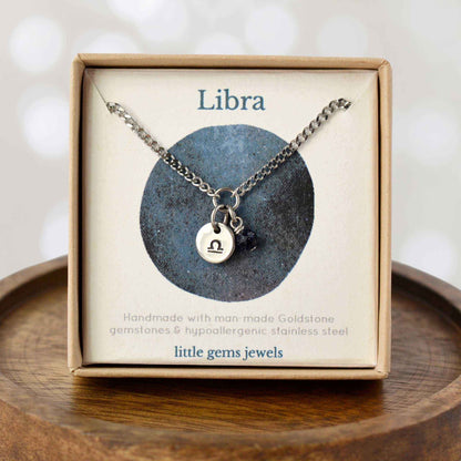 Dainty Libra zodiac sign necklace in eco-friendly gift box on wooden coaster