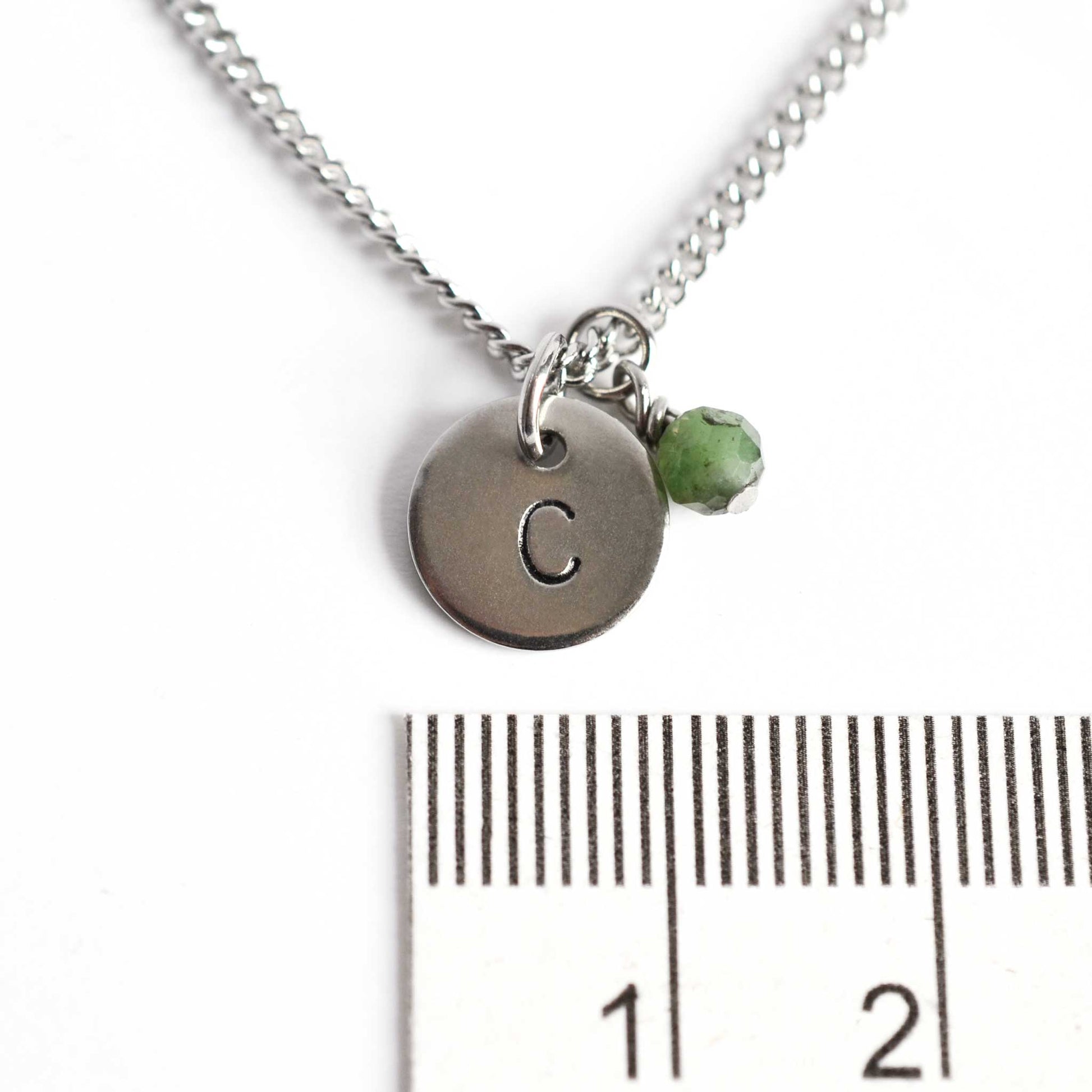 1cm diameter hand stamped initial pendant with 4mm May birthstone charm