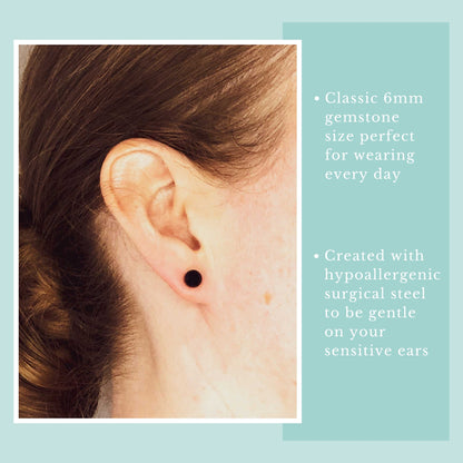 Close-up of an ear wearing a navy blue earring with text about gemstone size and material on a light blue background.