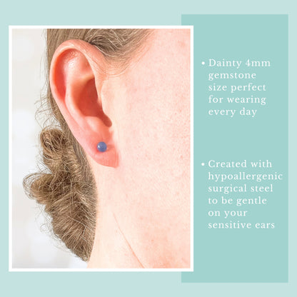 Model wearing small ligh blue gemstone stud earring.