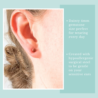 Model wearng tiny Goldstone ball stud earring.