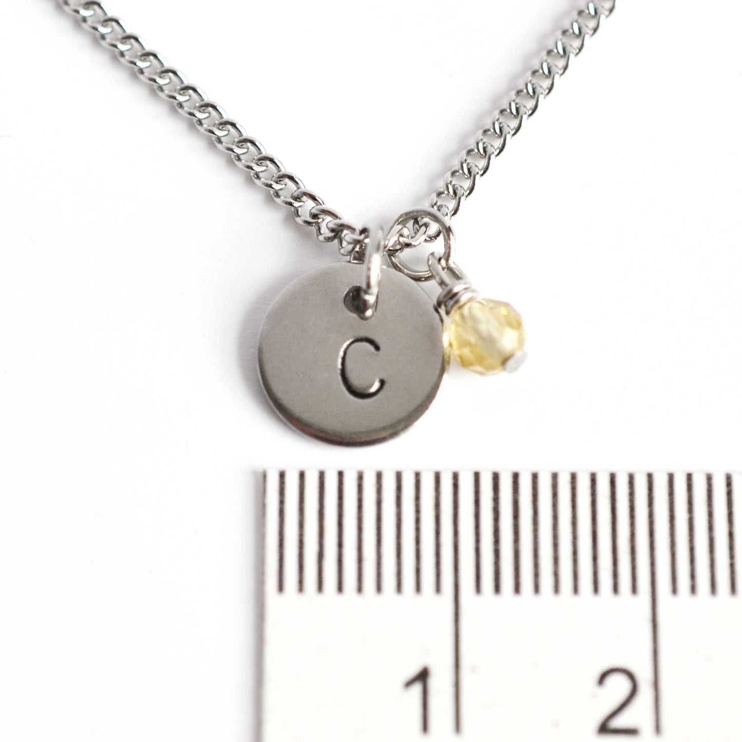 1cm diameter hand stamped initial pendant with 4mm November birthstone charm