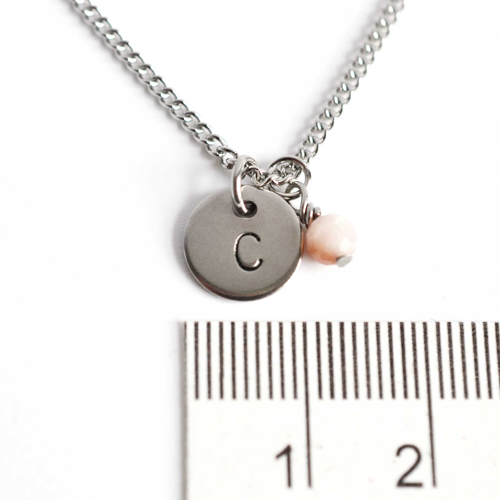 1cm diameter hand stamped initial pendant with 4mm October birthstone charm