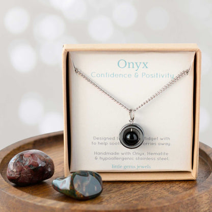 Onyx for confidence and positivity gemstone spinner necklace in eco friendly gift box.