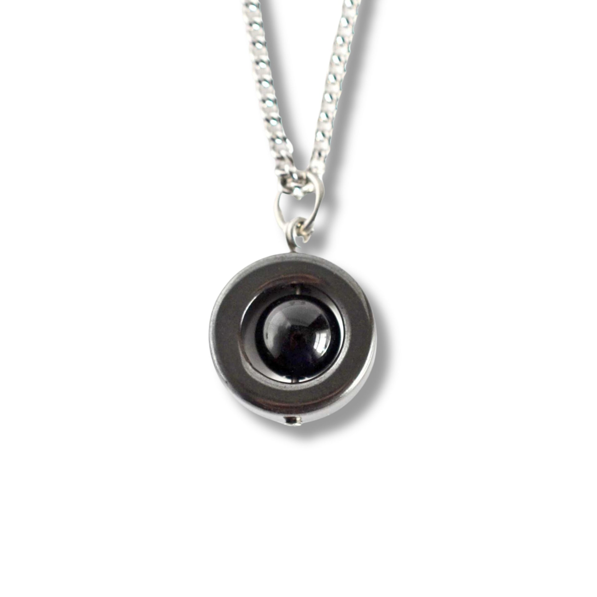 Onyx & Hematite gemstone spinner necklace on white backgound.