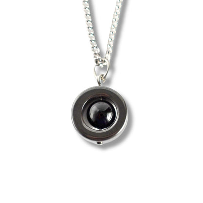 Onyx & Hematite gemstone spinner necklace on white backgound.