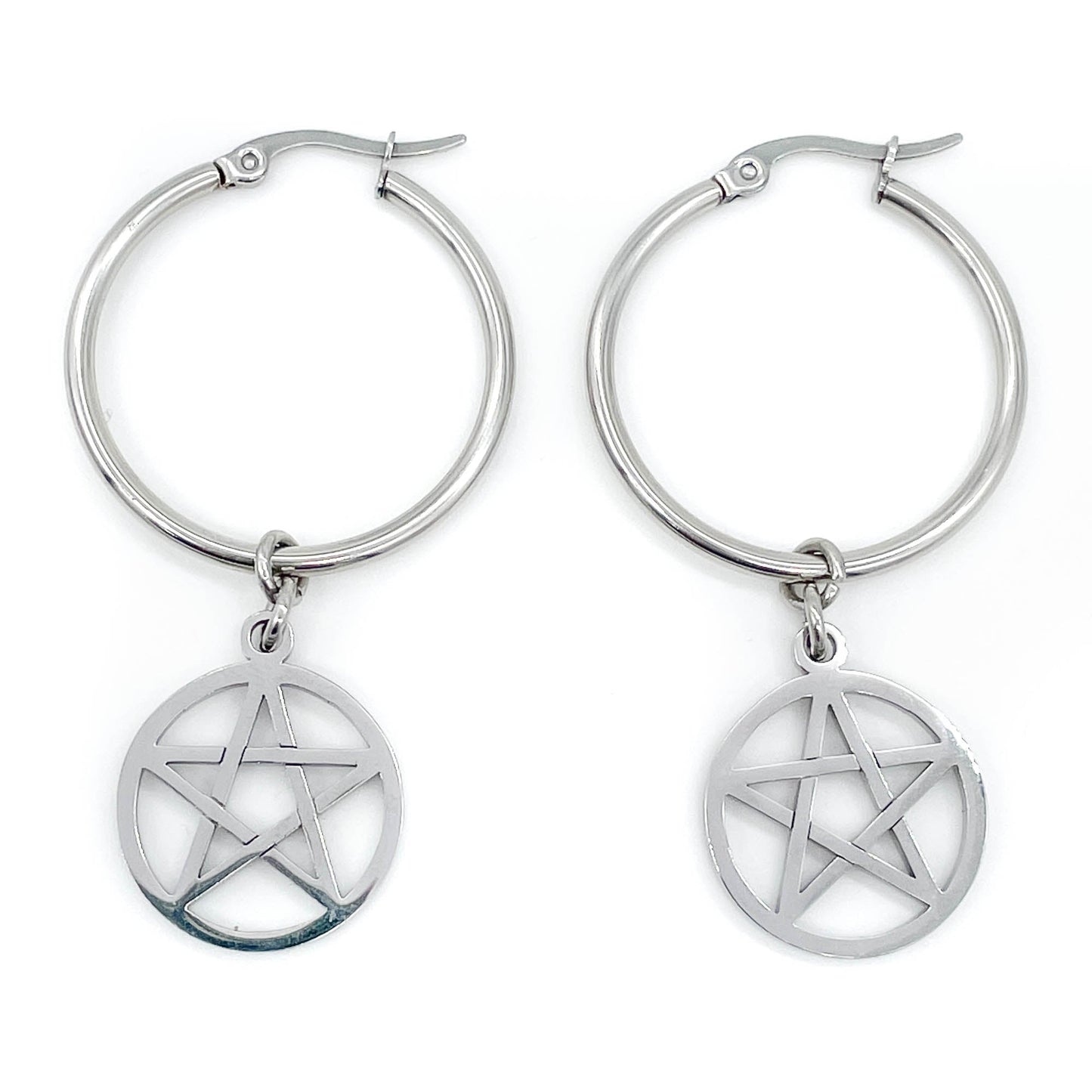Steel hoop earrings with pentagram charms on a white background