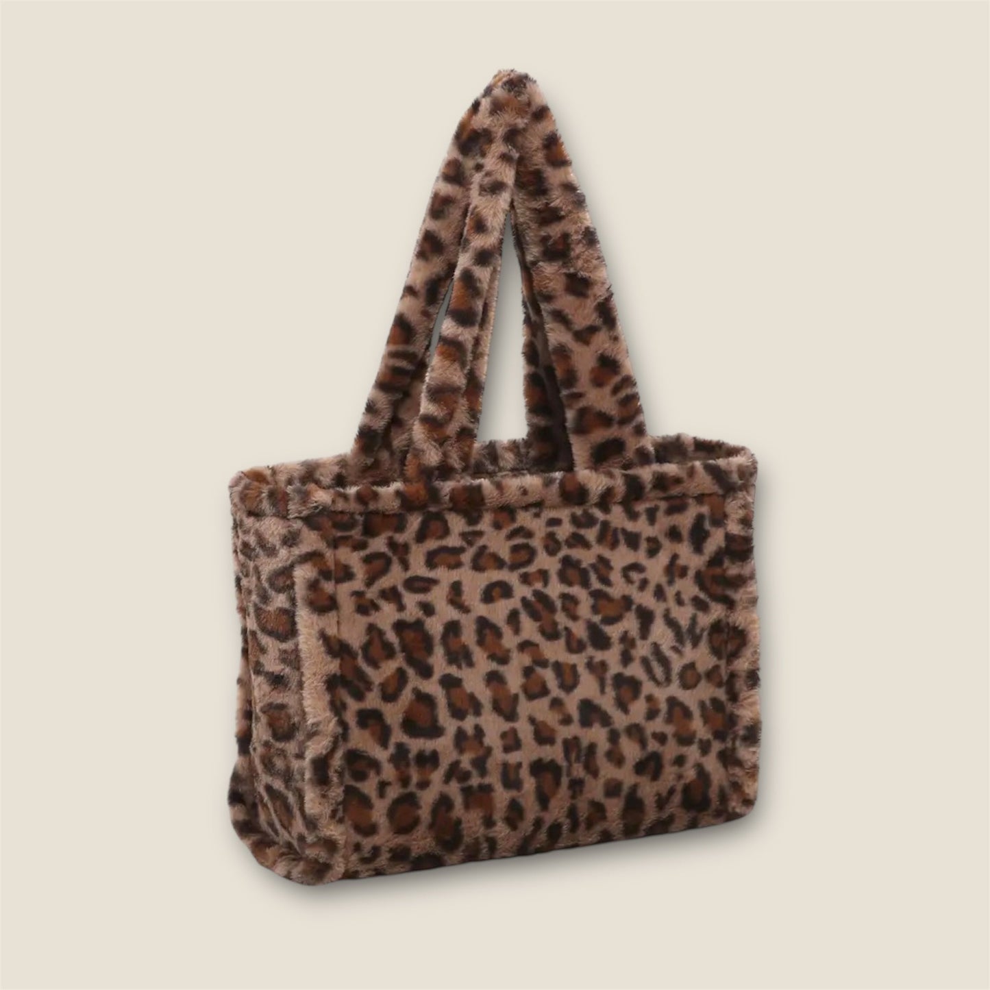 Leopard print tote bag on a beige background