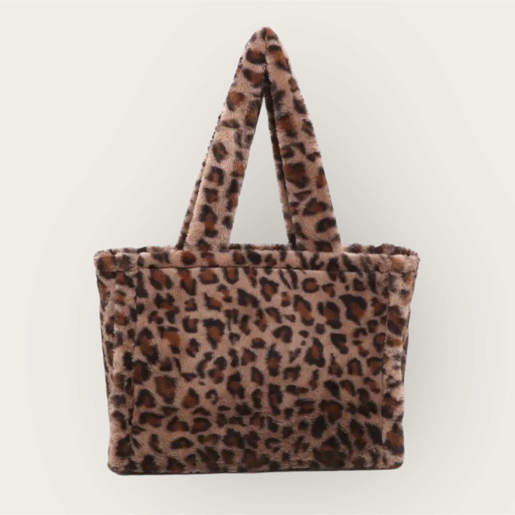 Leopard print tote bag on a light gray background