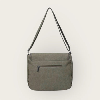 Back of green shoulder bag with a zipper on a white background