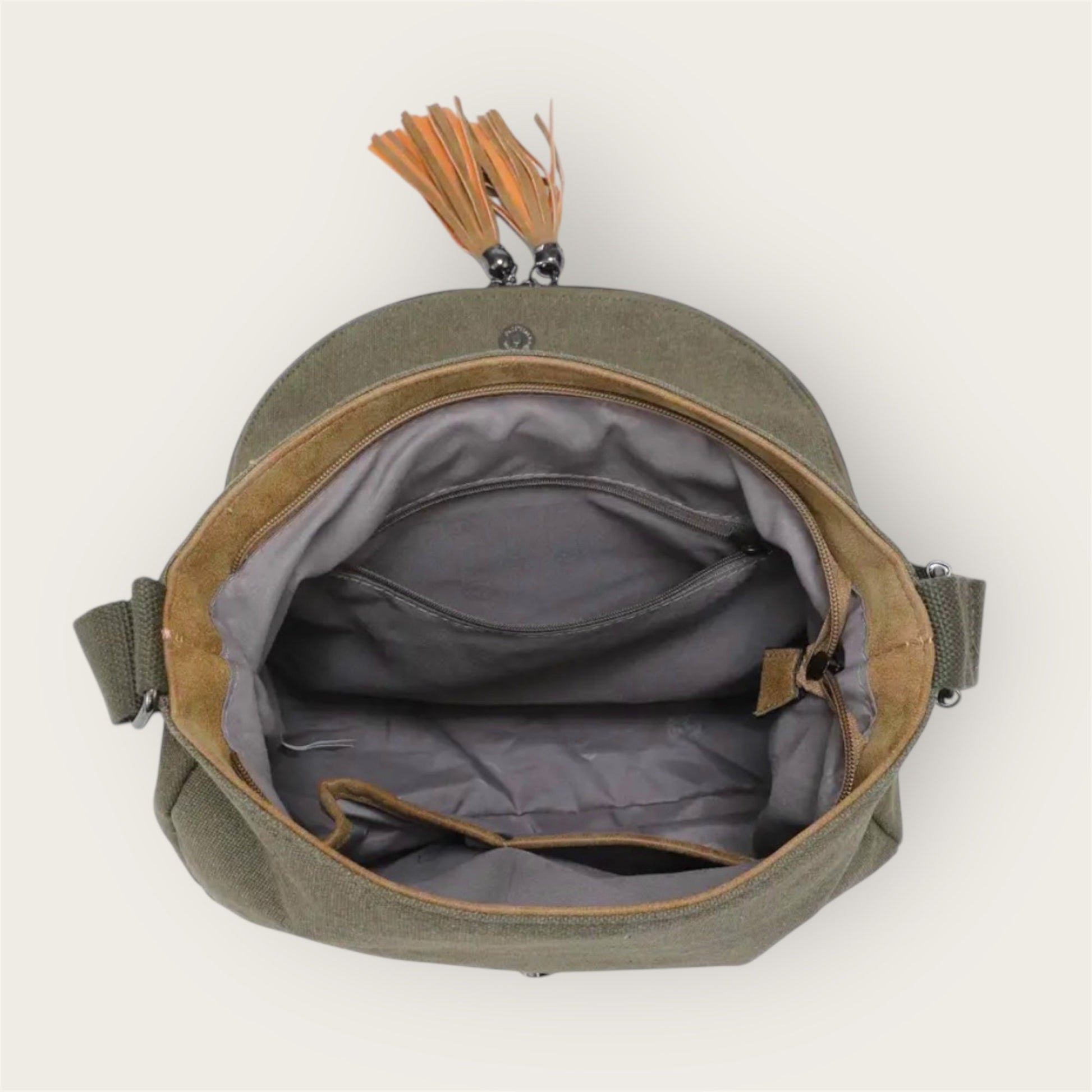 Inside of green bag with a tassel on a white background