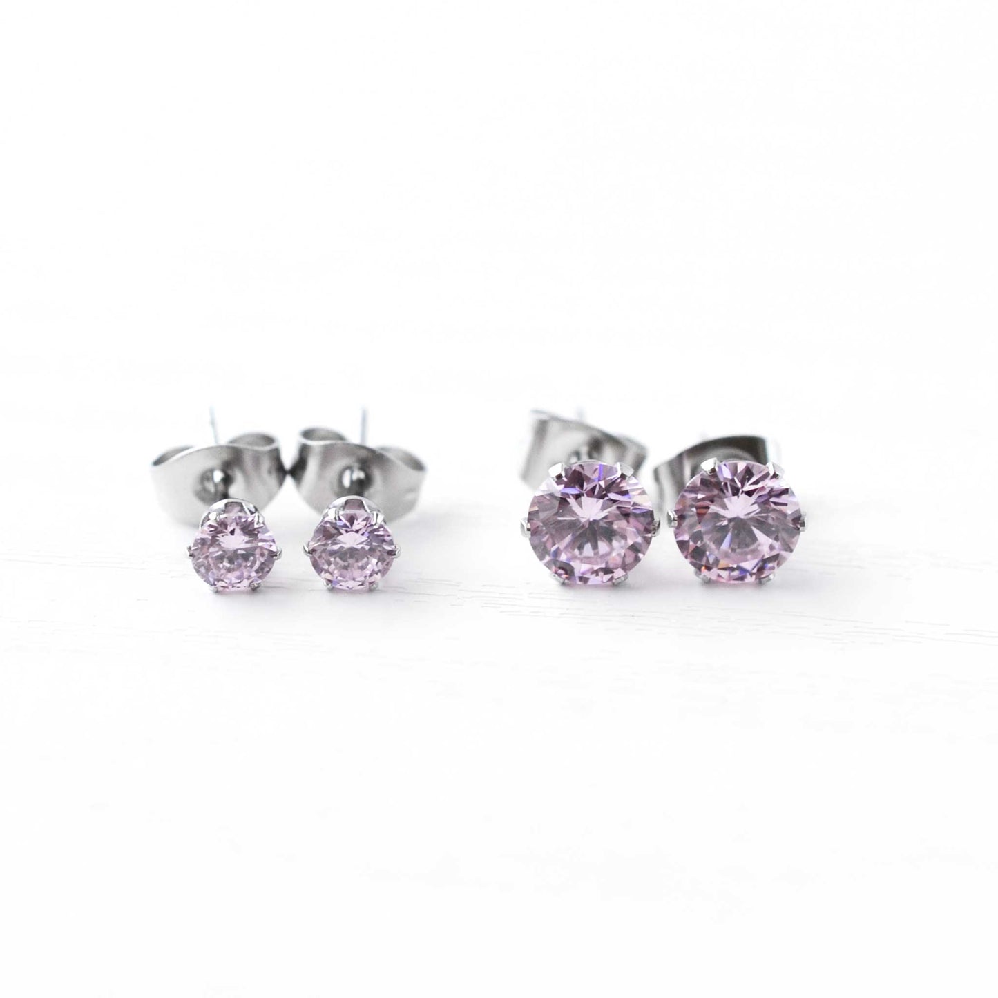 4mm & 6mm Pink CZ Stud Earrings On White Bcakground.