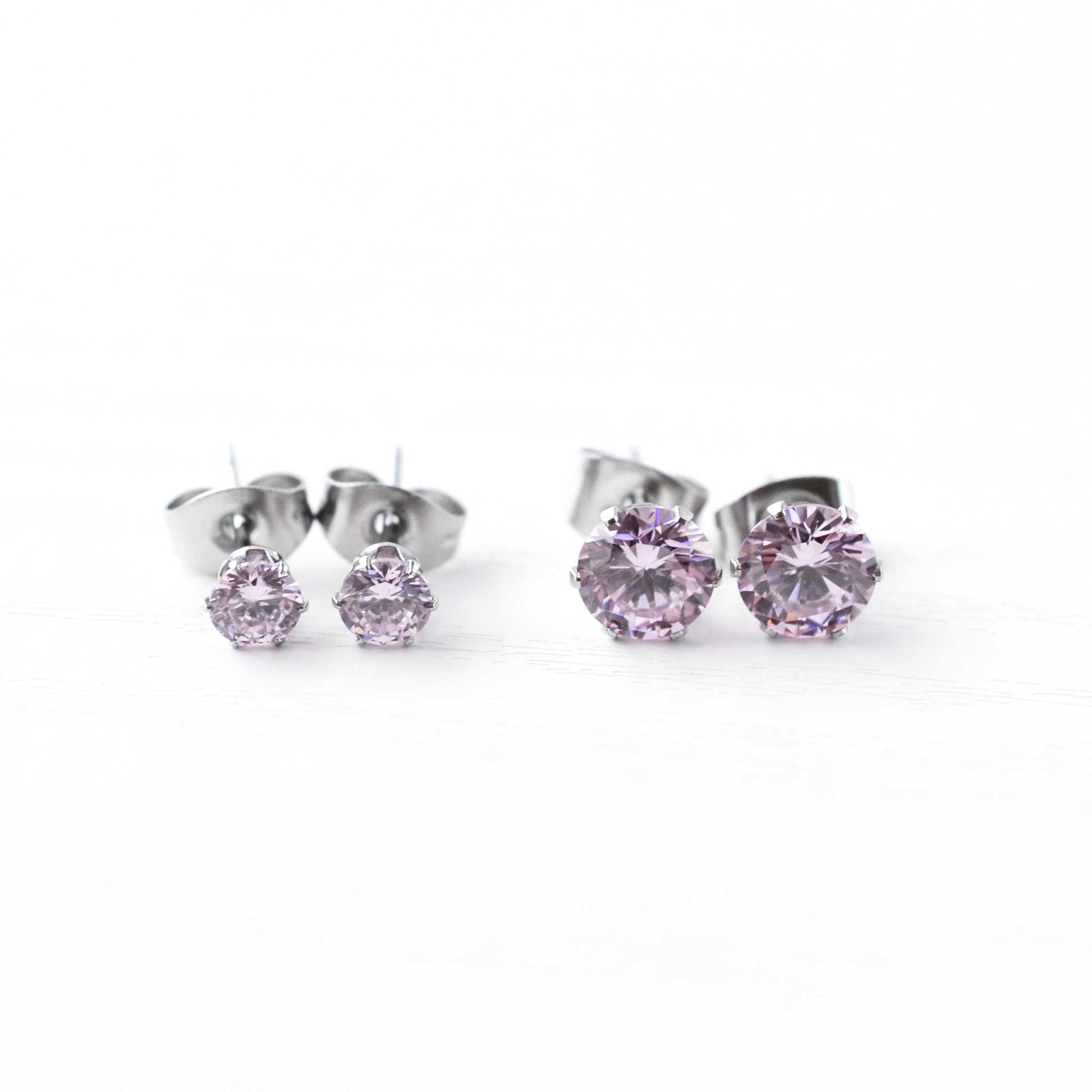 4mm & 6mm Pink CZ Stud Earrings On White Bcakground.