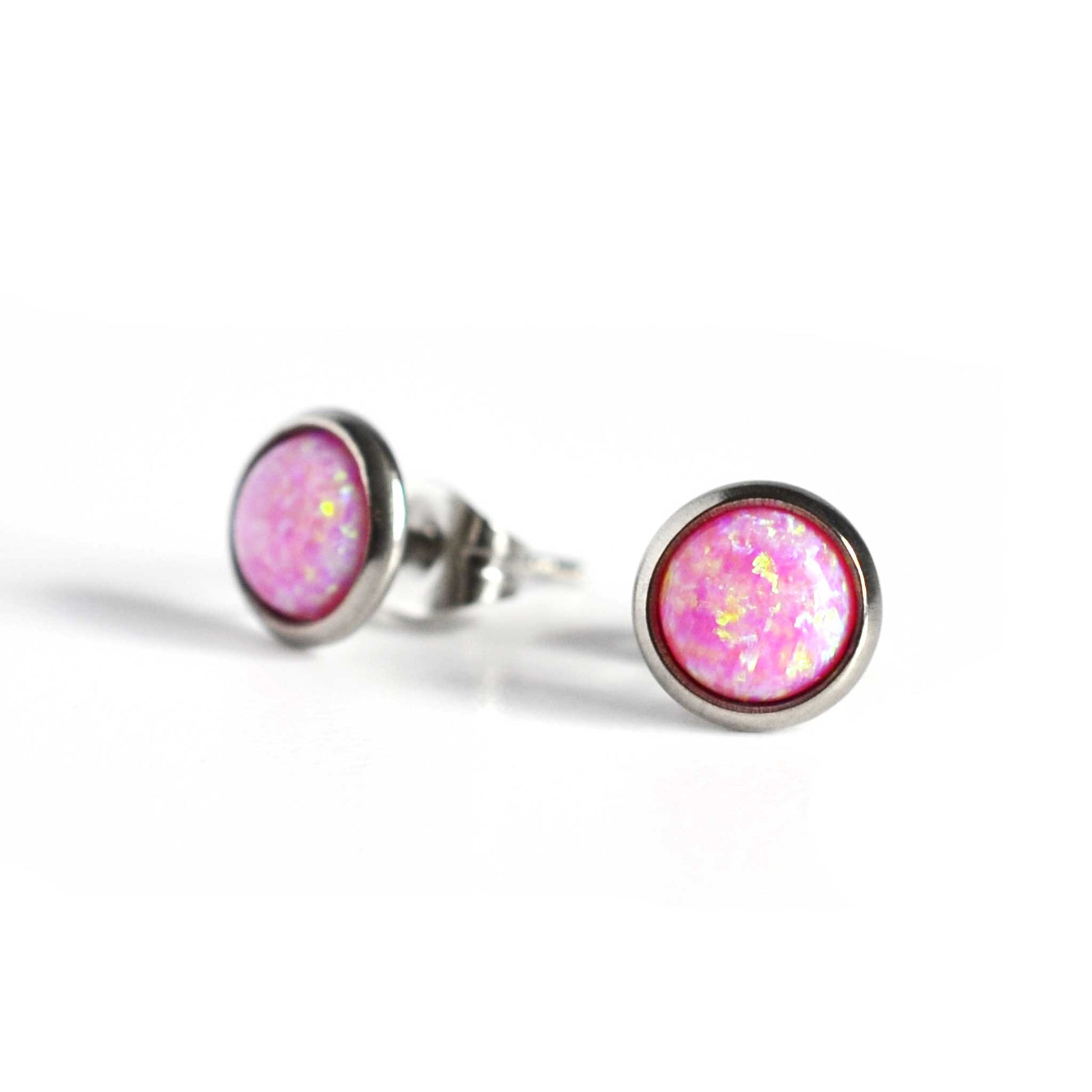Pink Opal gemstone stud earrings on white background