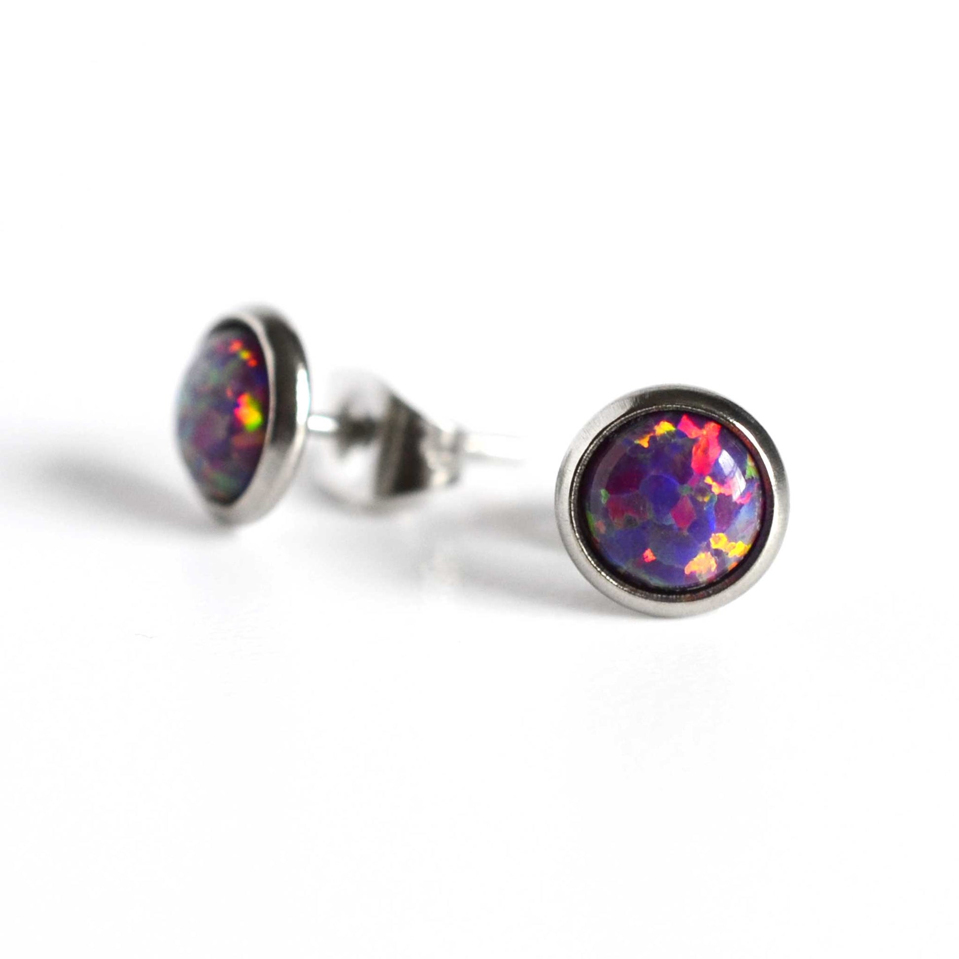 Purple Opal stud earrings on white background