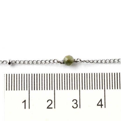 4mm gemstone bead on stainless steel ankle bracelet next to ruler