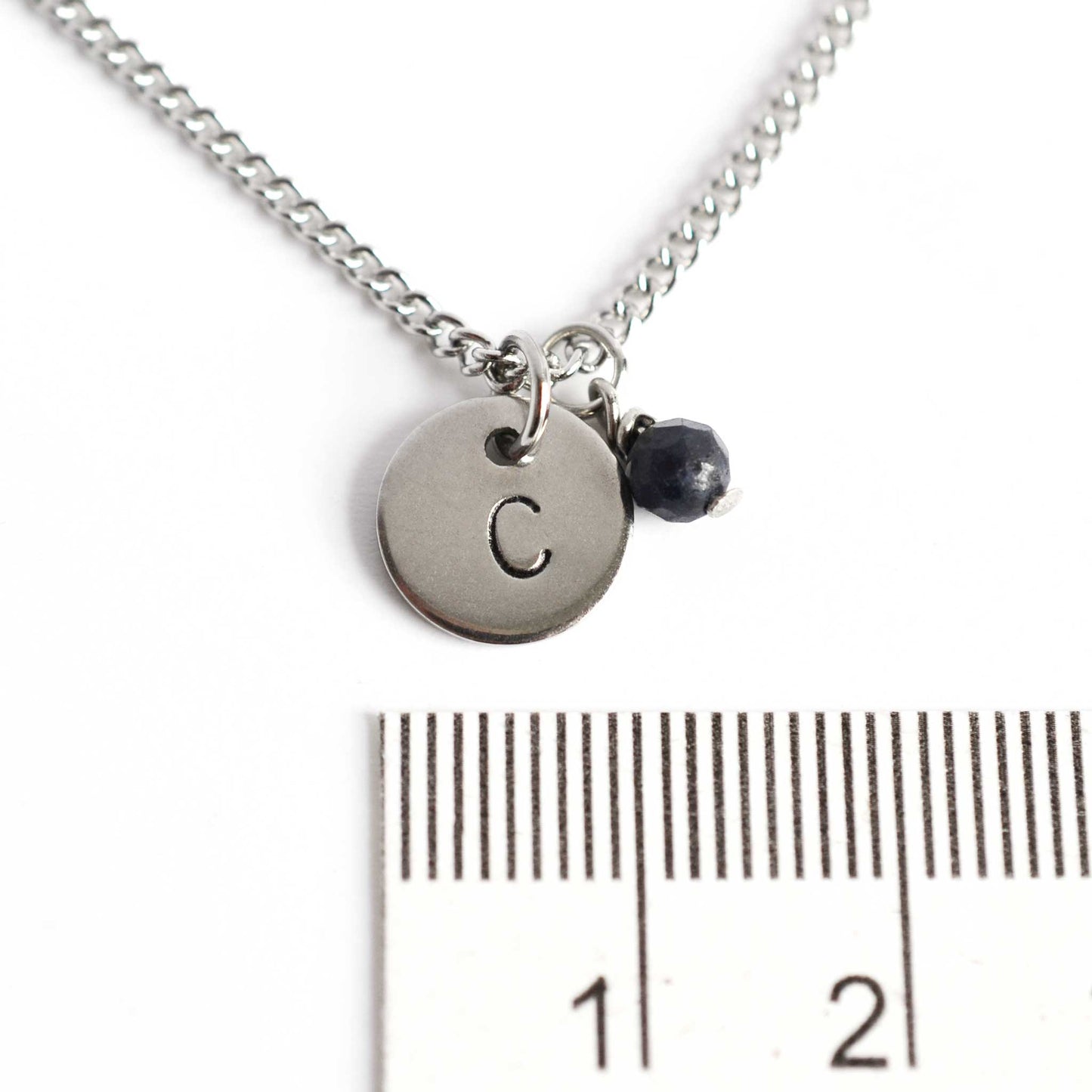 1cm diameter hand stamped initial pendant with 4mm September birthstone charm