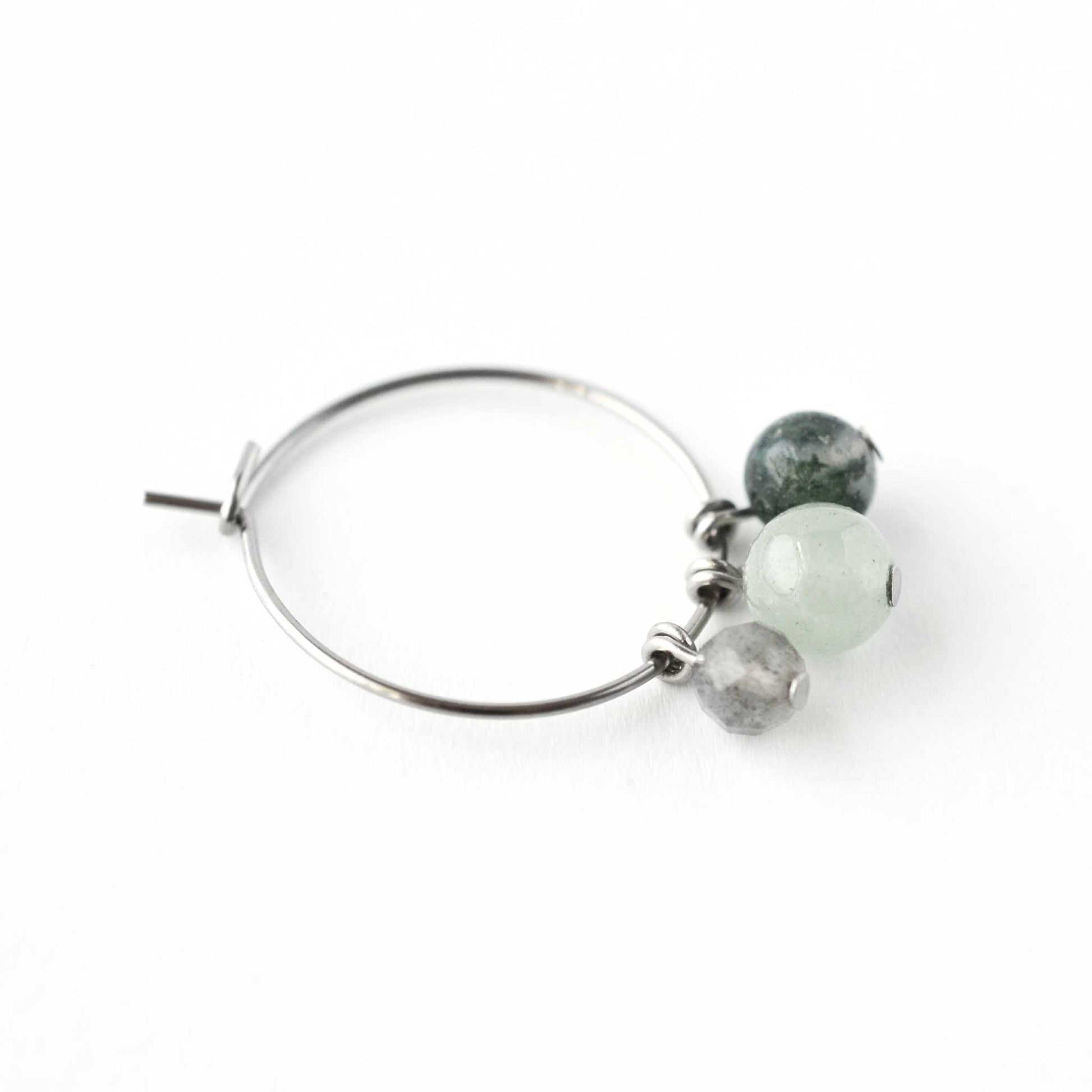 Close up of Labradorite, Green Aventurine & Moss Agate round gemstone beads hanging from hoop earring
