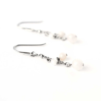 Close up of Rose Quartz, Pink Opal & Rainbow Moonstone beads on drop earrings