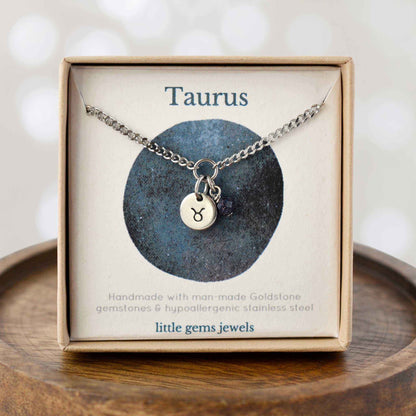 Dainty Taurus zodiac sign necklace in eco-friendly gift box on wooden coaster