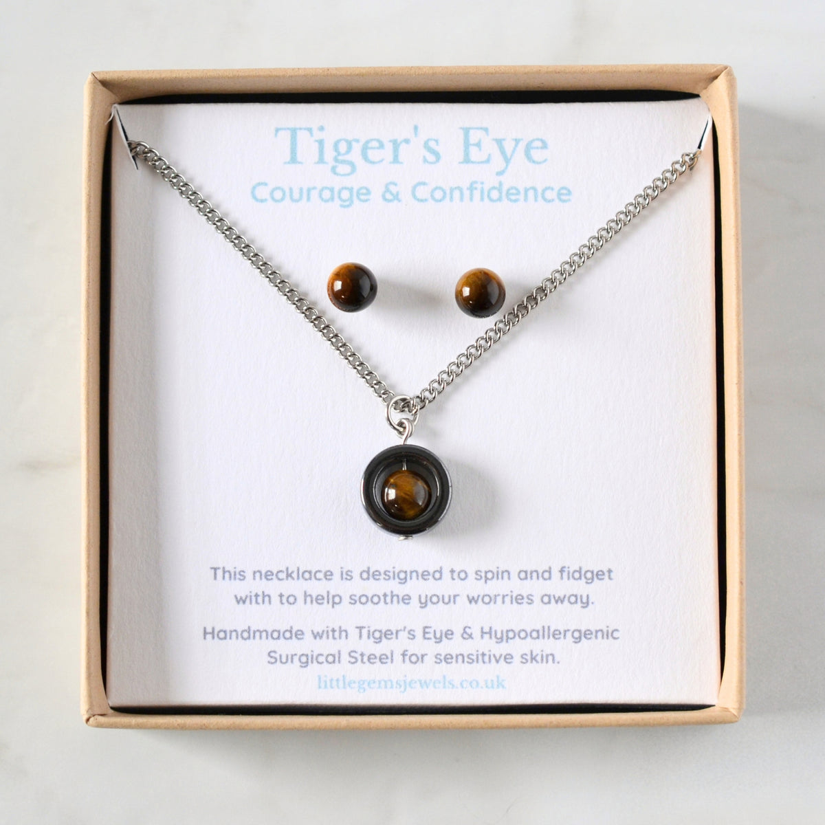 Matching Tiger's Eye spinner necklace and gemstone stud earrings set in eco friendly gift box.