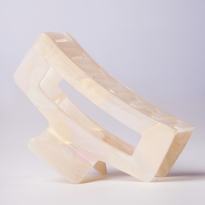 Hair clip geometric design on a light gray background