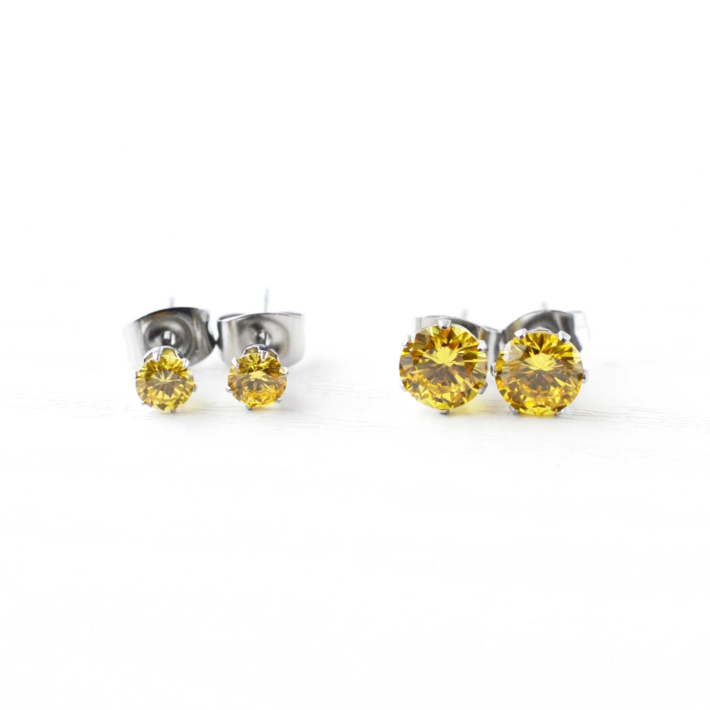 Yellow CZ stud earrings in 4mm & 6mm sizes