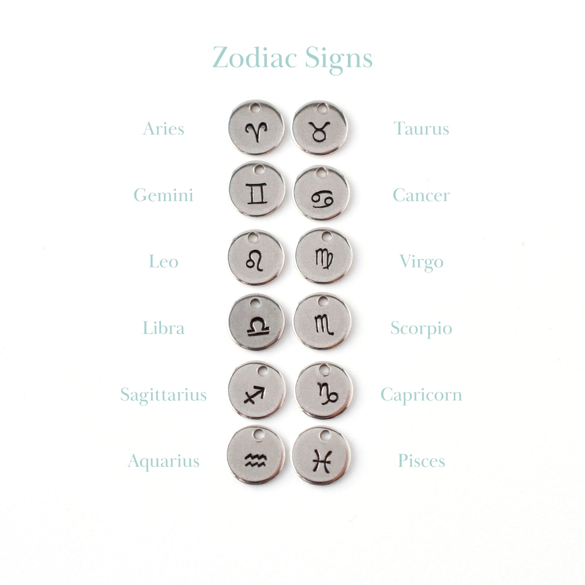 Handstamped zodiac sign charms.
