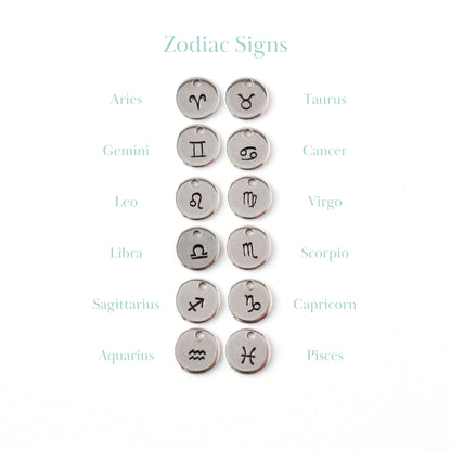 Handstamped zodiac sign charms.