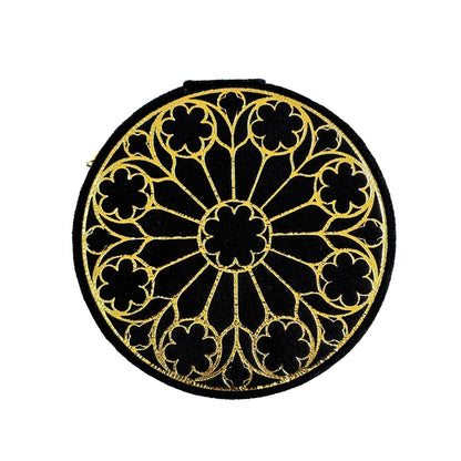 Round black and gold decorative box with gold pattern on a white background