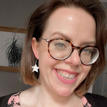 Mini gold star earrings