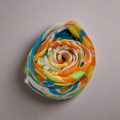 Colorful fabric flower on a plain background