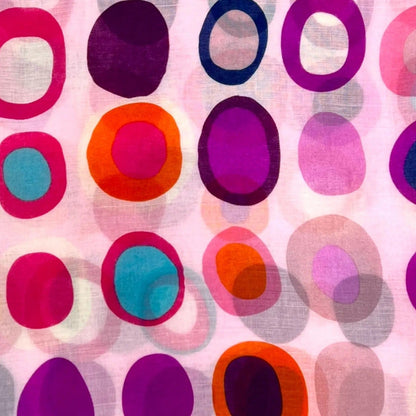Pattern of colorful circles on a pink background