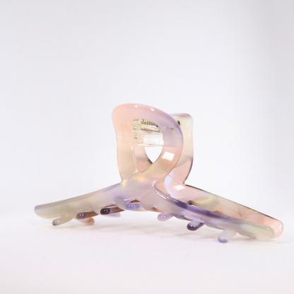Iridescent hair clip on a white background