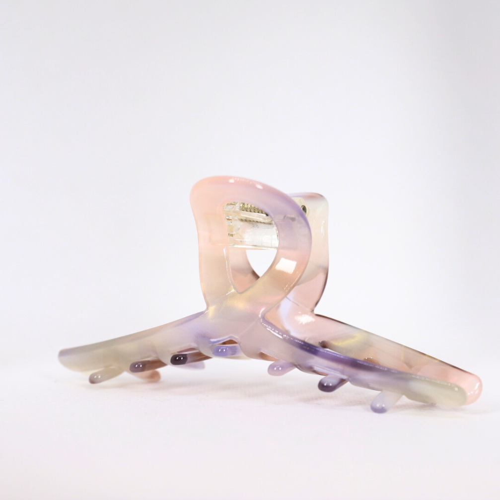 Iridescent hair clip on a white background