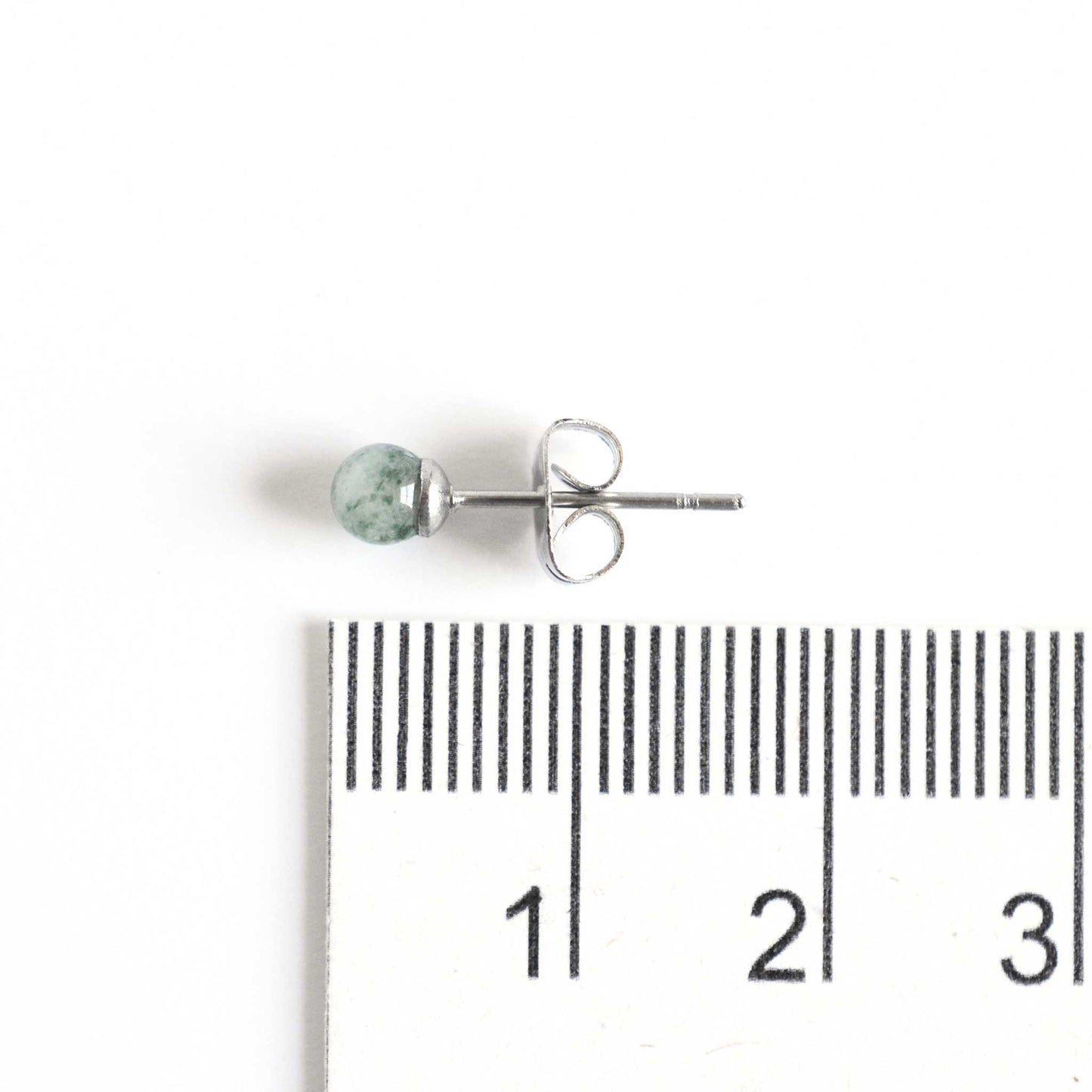 4mm Green Aventurine single stud earring next to ruler