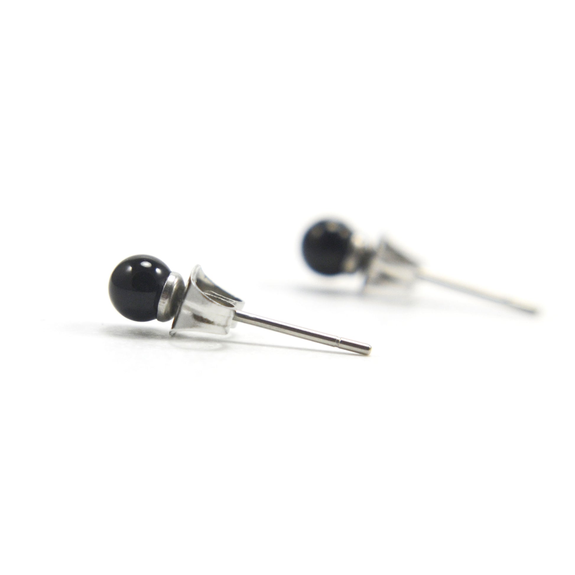 4mm black Onyx earrings on white background