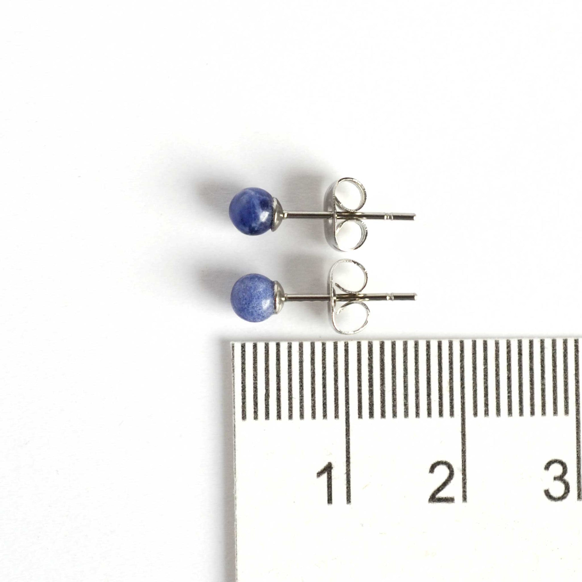 4mm Sodalite small blue stud earrings next to ruler