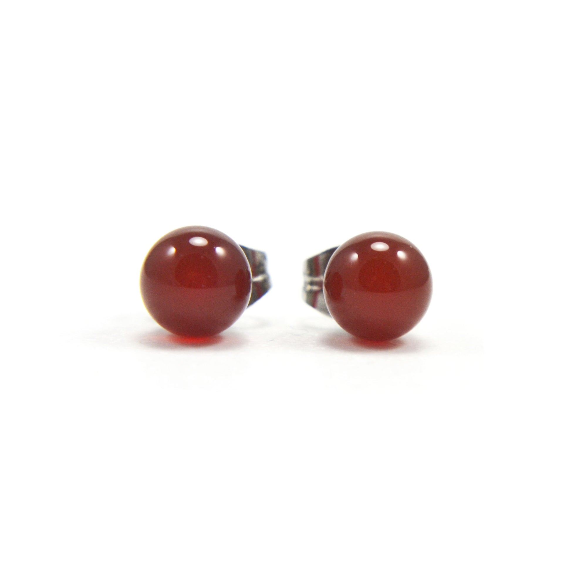 Front view of Carnelian ball stud earrings on white back background